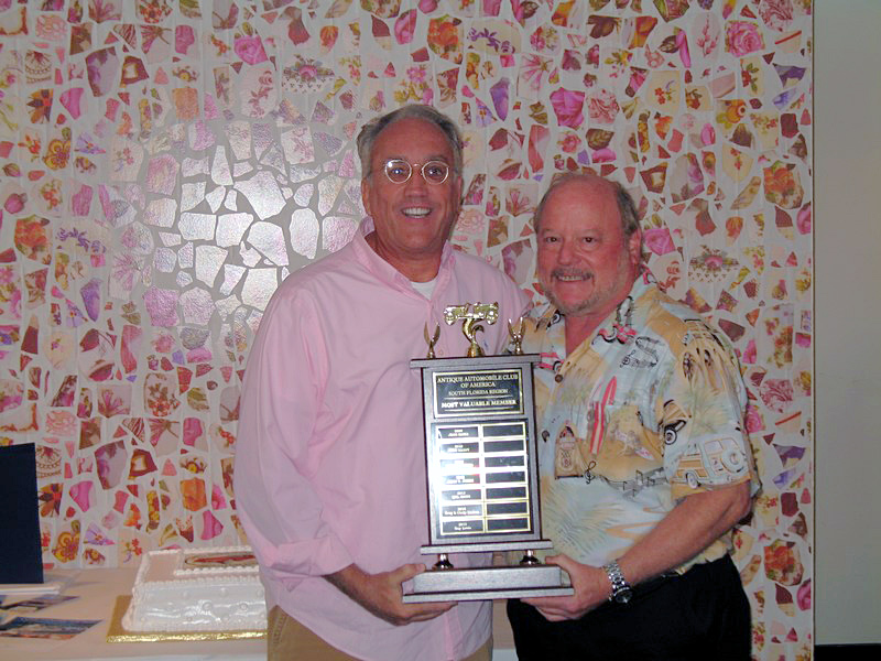 Guy Lewis receives Most Valuable Member Award from Mel Mann